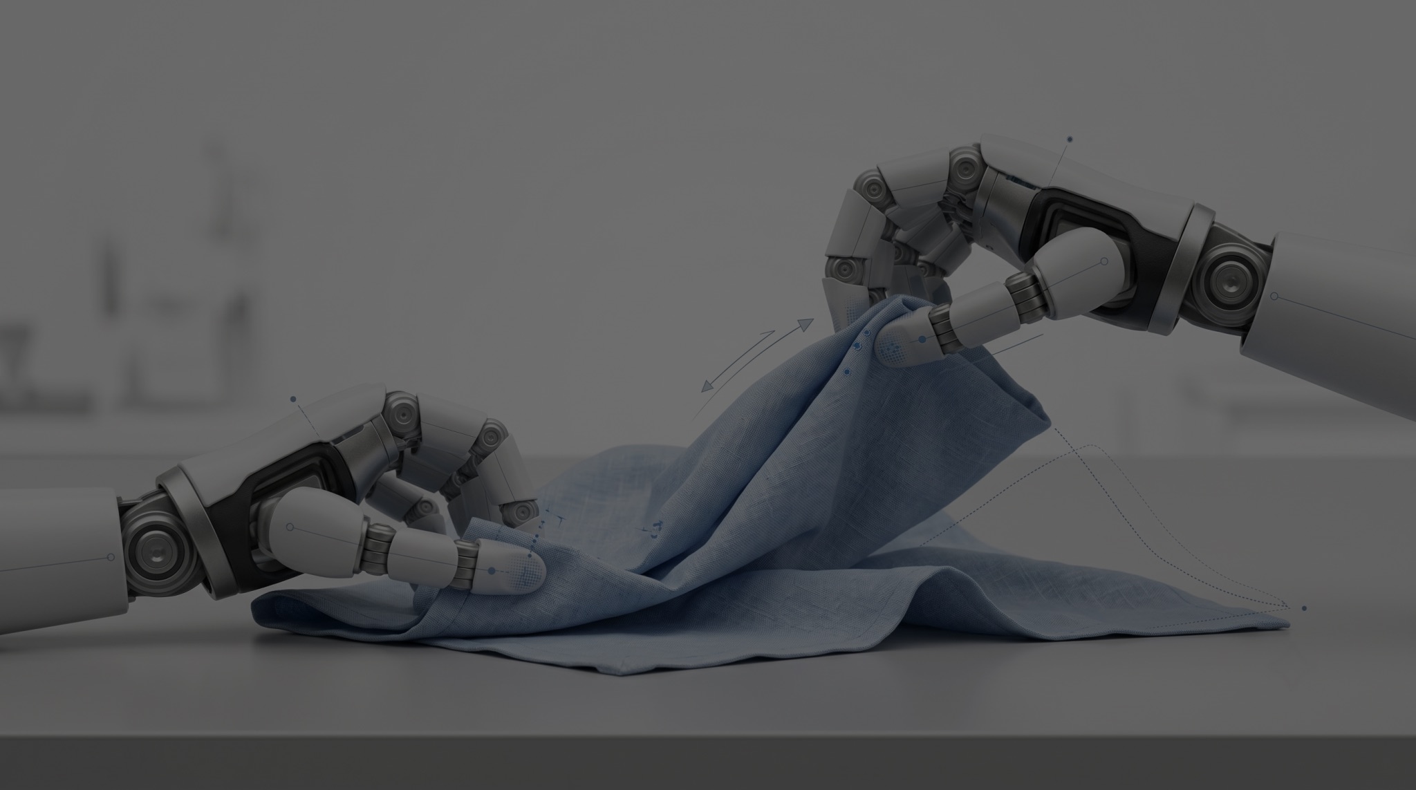 Two robotic hands folding a blue cloth
